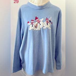 Snowman’s over shirt.